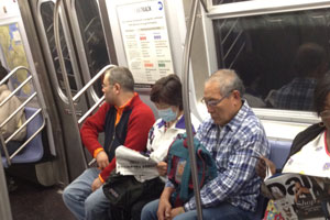 woman wearing respirator mask on nyc subway